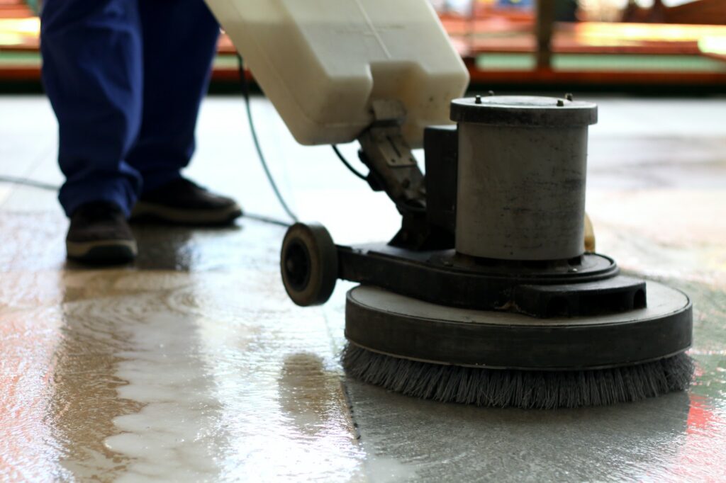 Cleaning machine washing the floor in a shopping mall